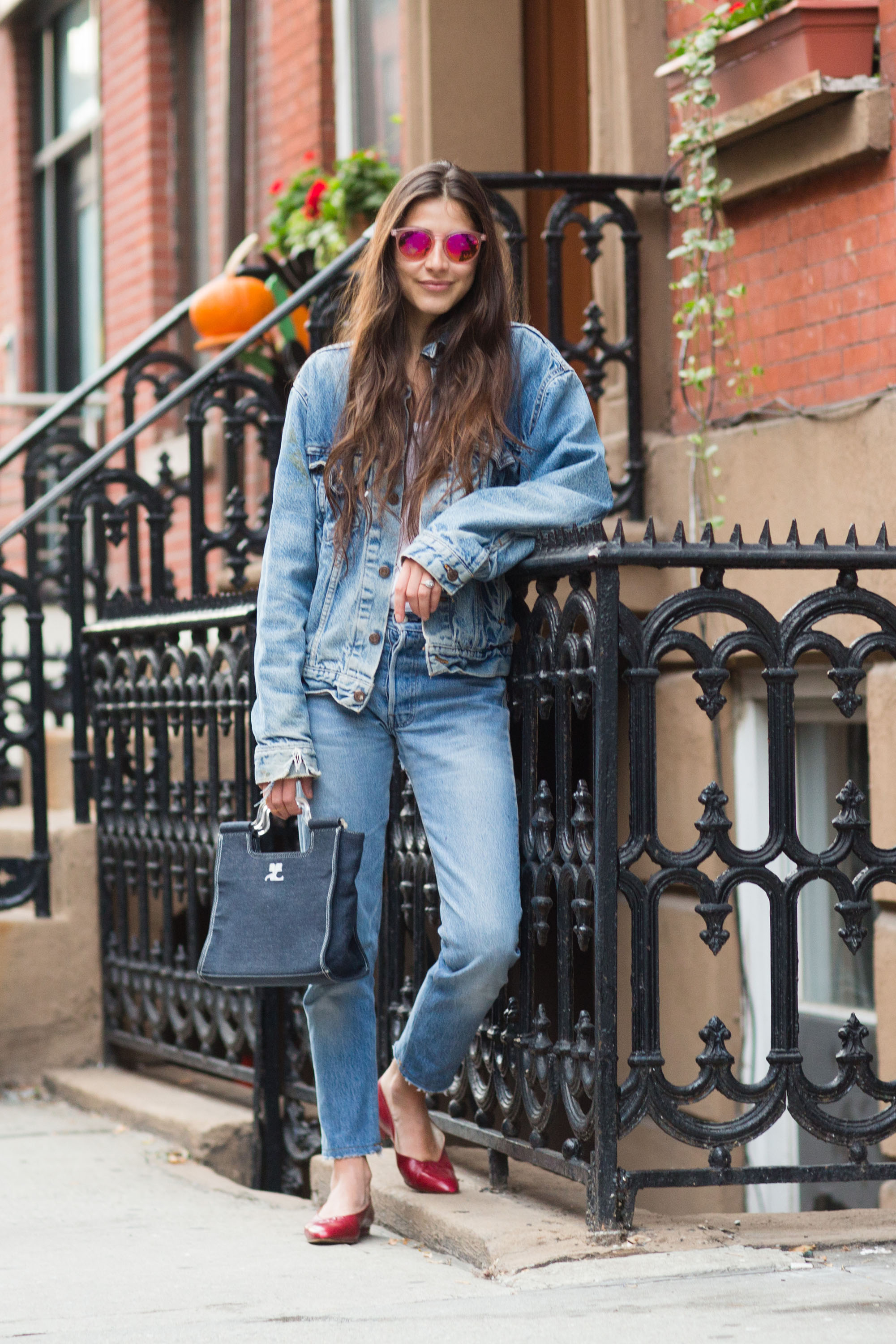 NEW YORK, NY - NOVEMBER 23: Writer and founder of Definer app Felicity Sargent wears a vintage Levi's denim jacket, Club Monaco t-shirt, vintage Redun jeans, Chanel flats, and Courrges bag in Chelsea on November 23, 2014 in New York City. (Photo by Melodie Jeng/Getty Images)