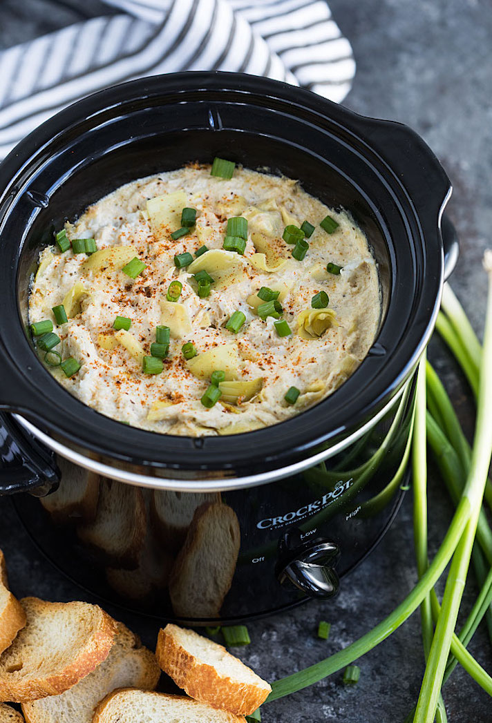 STYLECASTER | 17 Slow-Cooker Seafood Recipes for When You're Sick of Chili | Crab and Artichoke Dip