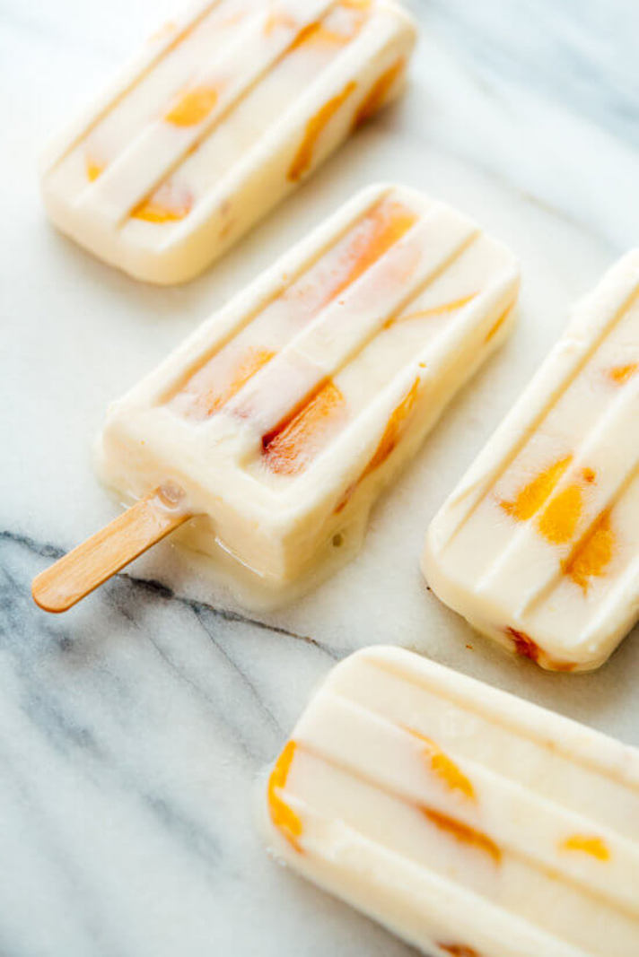 STYLECASTER | 17 DIY Popsicles To Make With All That Summer Fruit | Creamy Peach-Honey Popsicles