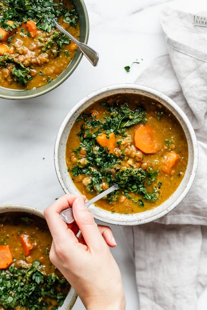 STYLECASTER | 16 Post-Workout Slow-Cooker Recipes That'll Make You Feel Great | Kale and Sweet Potato Lentil Stew