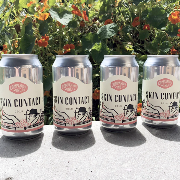 Four cans of skin-contact white wine