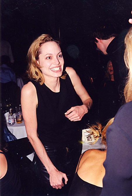 Angelina Jolie wearing a black tank top and black pants