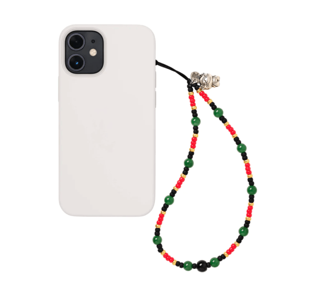 A phone attached to a beaded phone strap wristlet from String Ting