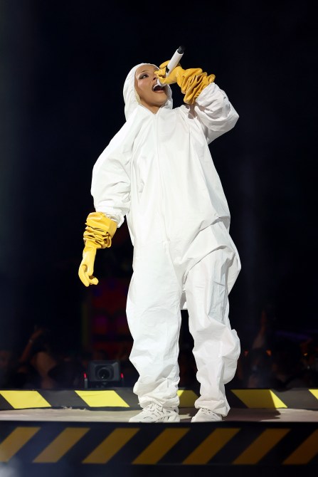 Doja Cat wearing a hazmat suit on stage at Coachella.