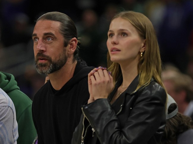 Aaron Rodgers and Mallory Edens watch Game Two of the Eastern Conference First Round Playoffs between the Milwaukee Bucks and the Chicago Bulls at Fiserv Forum on April 20, 2022 in Milwaukee, Wisconsin.