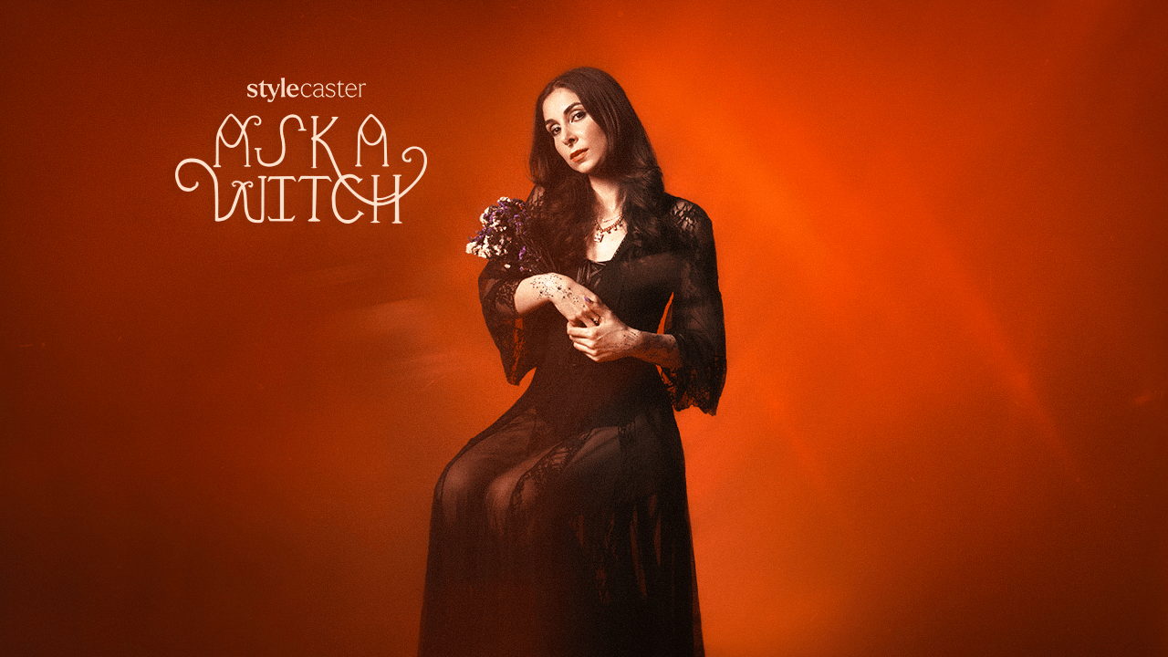 A witch woman holding a bouquet of flowers and herbs, getting ready to give you life-saving advice using astrology.