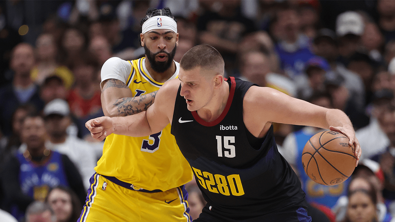 Nikola Jokic #15 of the Denver Nuggets drives against Anthony Davis #3 of the Los Angeles Lakers in the fourth quarter during game two of the Western Conference First Round Playoffs at Ball Arena on April 22, 2024 in Denver, Colorado.