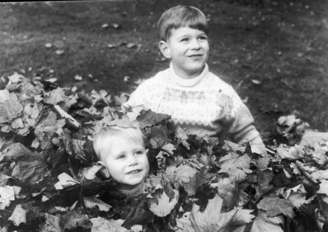 19th February 1966:  Prince Edward and Prince Andrew playing with fallen leaves in the grounds of Buckingham Palace.