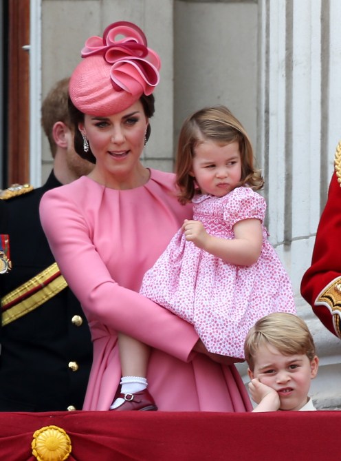 Catherine, Duchess of Cambridge, Princess Charlotte of Cambridge and Prince George of Cambridge look out from the balcony of Buckingham Palace during the Trooping the Colour parade on June 17, 2017 in London, England.