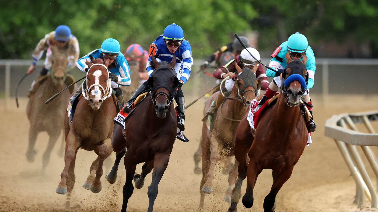 Jockey John Velazquez #1 on National Treasure (R) and jockey Irad Ortiz Jr. #7 aboard Blazing Sevens at the  Pimlico Race Course on May 20, 2023.