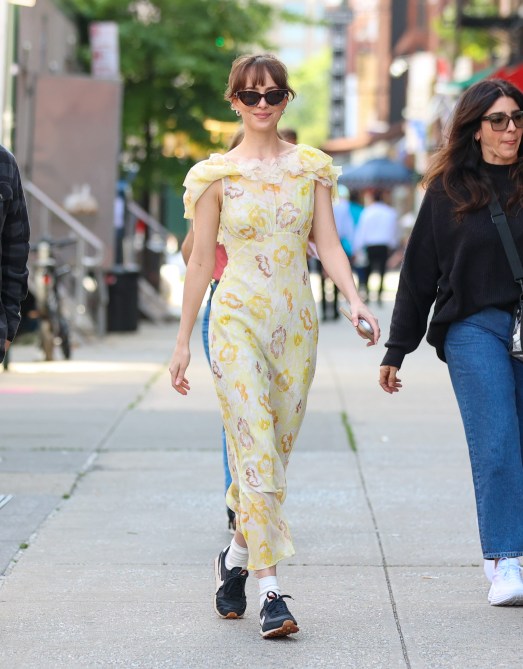 Dakota Johnson wearing a floral Easter dress with Nike sneakers.