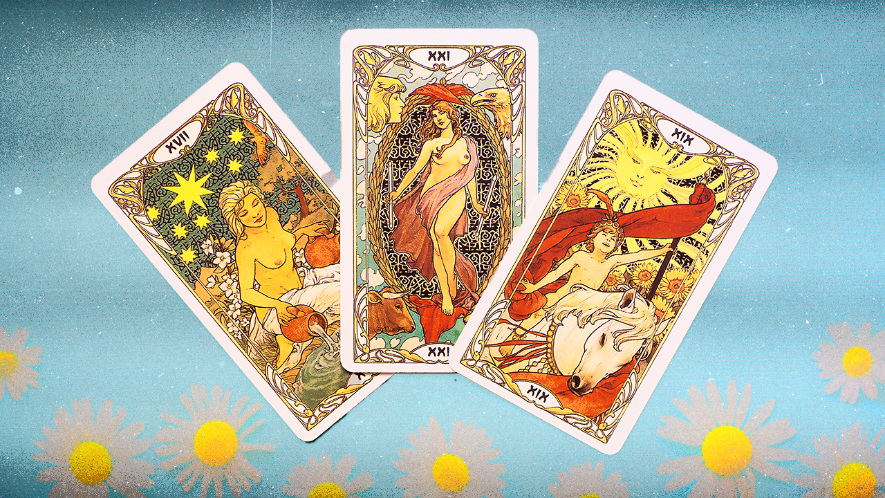 A set of three tarot cards over a blue background with white daisies