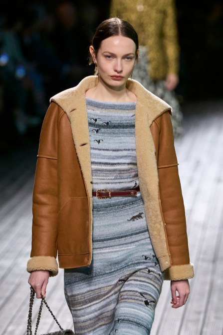 A model wearing a shearling coat.