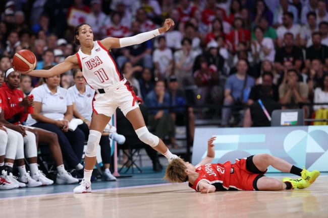 Napheesa Collier #11 of Team United States attempts to save a loose ball over Saki Hayashi #27 of Team Japan during the Women's Group Phase - Group C game between Japan and United States on day three of the Olympic Games Paris 2024 at Stade Pierre Mauroy on July 29, 2024 in Lille, France.