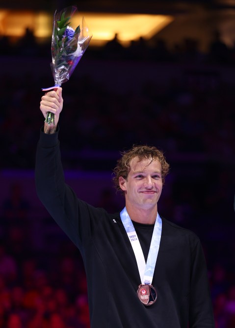 Drew Kibler of the United States reacts during the Men's 200m freestyle medal ceremony on Day Three of the 2024 U.S. Olympic Team Swimming Trials at Lucas Oil Stadium on June 17, 2024 in Indianapolis, Indiana.