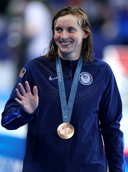 Bronze Medalist, Katie Ledecky  of Team United States waves whilst wearing her medal following the Medal Ceremony after the Women's 400m Freestyle Final on day one of the Olympic Games Paris 2024 at Paris La Defense Arena on July 27, 2024 in Nanterre, France.