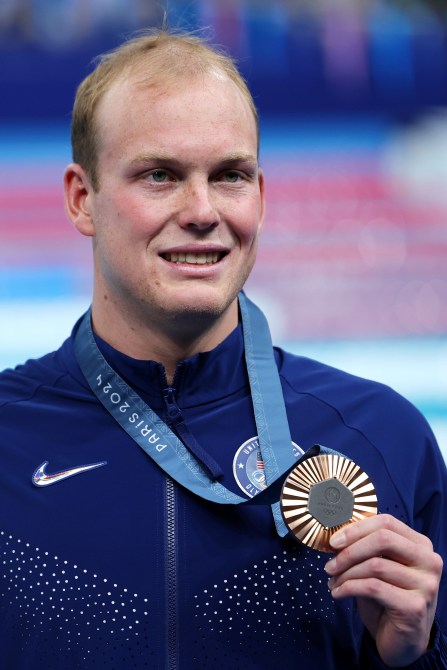 Bronze Medalist Luke Hobson of Team United States poses following the Swimming medal ceremony after the Men’s 200m Freestyle Final on day three of the Olympic Games Paris 2024 at Paris La Defense Arena on July 29, 2024 in Nanterre, France.