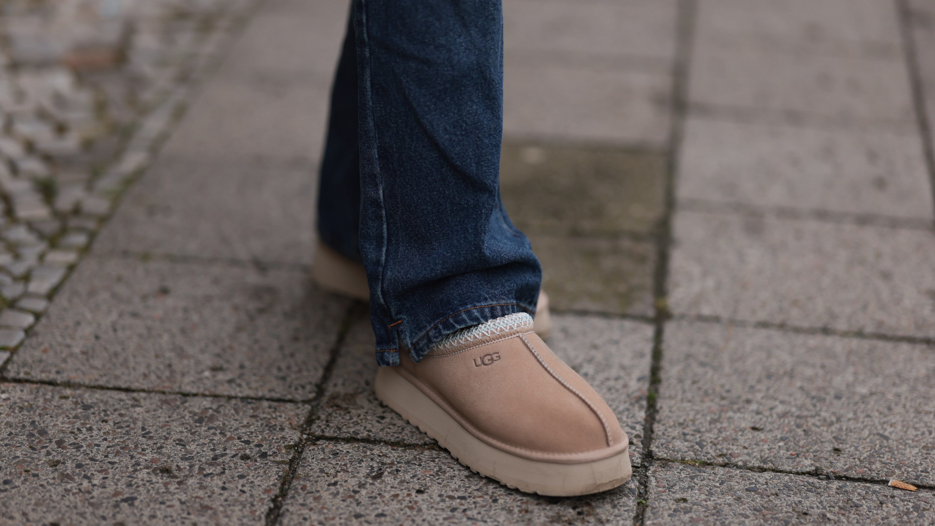 Sophia Geiss is seen wearing straight-legged jeans with orange decorative seams from Worst Behavior, and sand-colored platform shoes from Ugg on September 26, 2024 in Berlin, Germany.