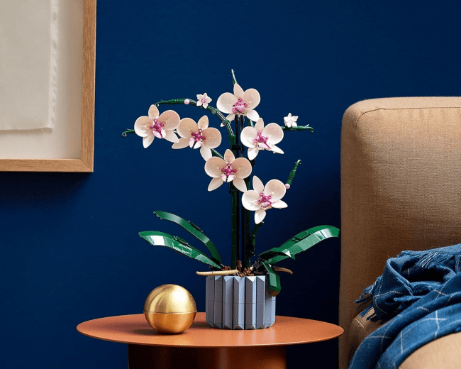 LEGO Icons Orchid Artificial Plant built and displayed on a side table