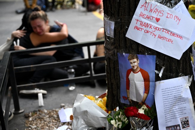 Fans pay tribute to British singer Liam Payne in front of the hotel where he died in Buenos Aires on October 17, 2024. Tributes poured in Thursday for British singer Liam Payne, a former member of the best-selling boy band One Direction, after he plunged to his death from the balcony of a Buenos Aires hotel.