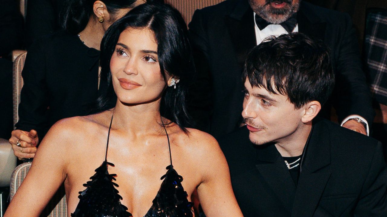 Kylie Jenner and Timothée Chalamet sit together wearing coordinating black outfits at the 2025 BAFTAs.