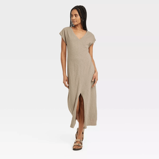 A model wearing the Universal Thread Short Sleeve Midi T-Shirt Dress in light brown