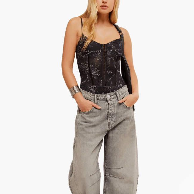 A model wearing the Free People Intimately FP Floral Mesh Bodysuit.