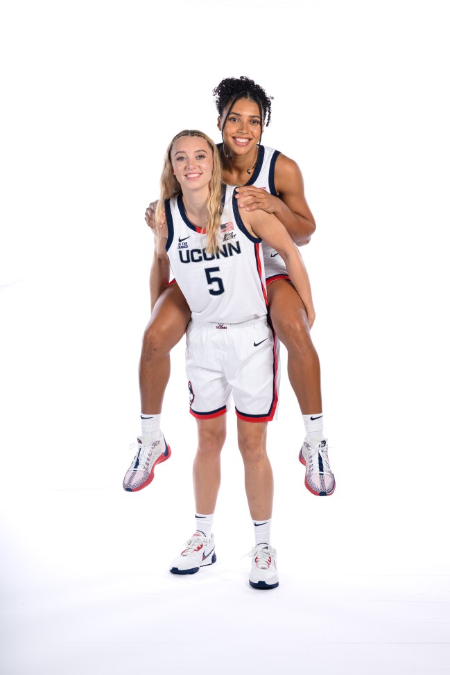 STORRS, CONNECTICUT - SEPTEMBER 22: Paige Bueckers #5 and Azzi Fudd #35 of the Connecticut Huskies pose for a portrait during the team's media day at the Werth Family Basketball Center on September 22, 2024 in Storrs, Connecticut.