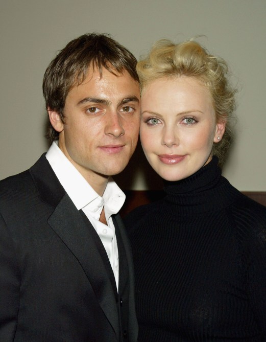 LOS ANGELES - APRIL 6:  Actor Stuart Townsend and his girlfriend actress Charlize Theron pose at the after-party for RKO Pictures' "Shade" on April 6, 2004 in Los Angeles, California.