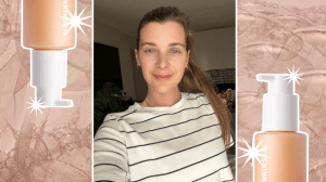 A selfie of a woman with two cleanser bottles